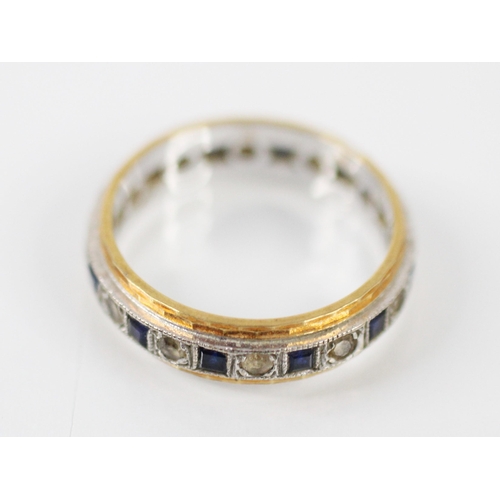 179 - An untested sapphire and paste eternity ring, the calibre cut sapphires interspersed with round cut ... 