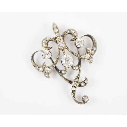 192 - A late 19th century diamond swag necklace/brooch, the central openwork detachable brooch with four o... 