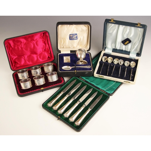 121 - A cased set of Edwardian silver napkin rings, Josiah Williams & Co, London 1908, with floral engrave... 