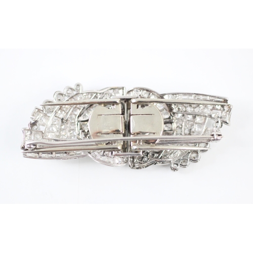 199 - A mid 20th century diamond duet clips/brooch, the mixed cut diamonds within a white metal openwork s... 