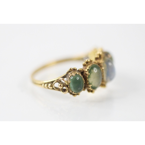 240 - A 20th century untested moonstone ring, the five graduated oval cabochon stones set within a closed ... 