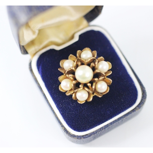 276 - A 9ct yellow gold and untested pearl dress ring, designed as a flowerhead with multiple petals, set ... 