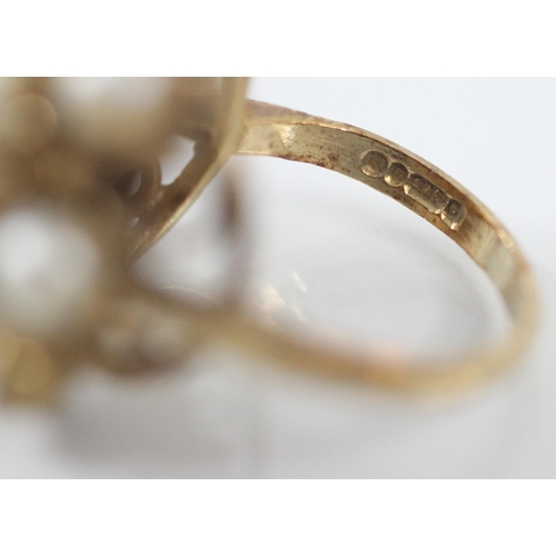 276 - A 9ct yellow gold and untested pearl dress ring, designed as a flowerhead with multiple petals, set ... 