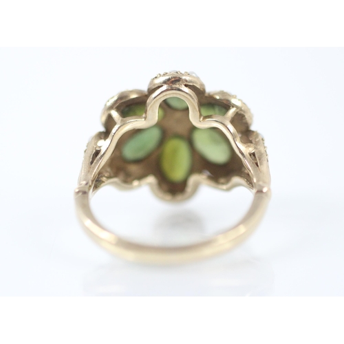 185 - A Victorian style untested tourmaline and seed pearl ring, the six oval cut tourmalines designed wit... 