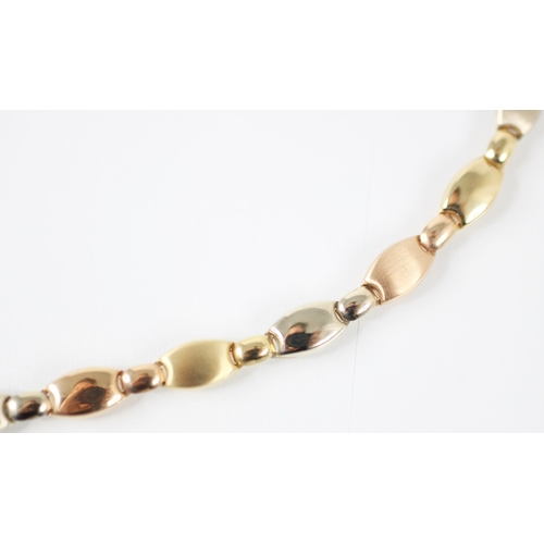 205 - A multi tone yellow gold necklace, the flat oval links alternating between multi tone matte examples... 