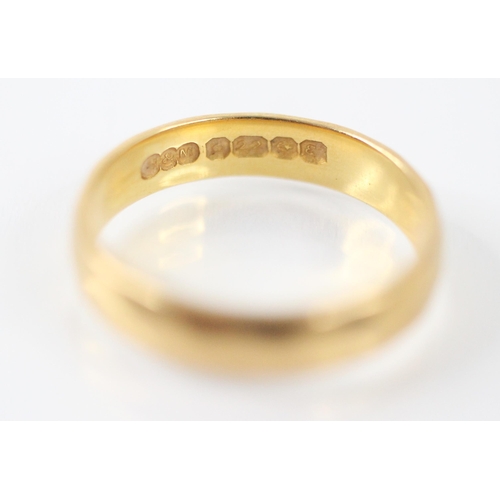 224 - A 22ct yellow gold wedding band, the faceted band stamped 'H&M' Birmingham 1979, ring size P 1/2, 5.... 