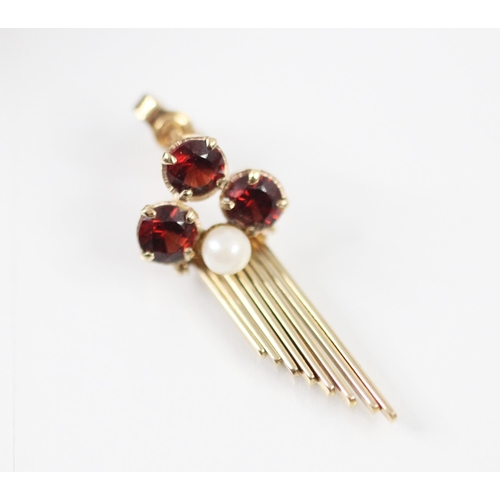 291 - A pair of 'garnet' coloured earrings, the three round cut 'garnets' claw set with a central paste pe... 