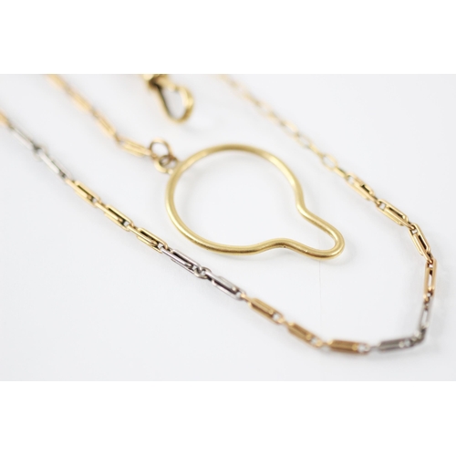 410 - An early 20th century two tone chain, the elongated trace links alternating between yellow metal and... 