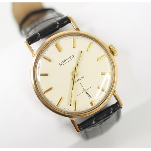 469 - A gentlemans 9ct yellow gold Roamer incabloc wristwatch, the cream coloured dial with baton markers ... 