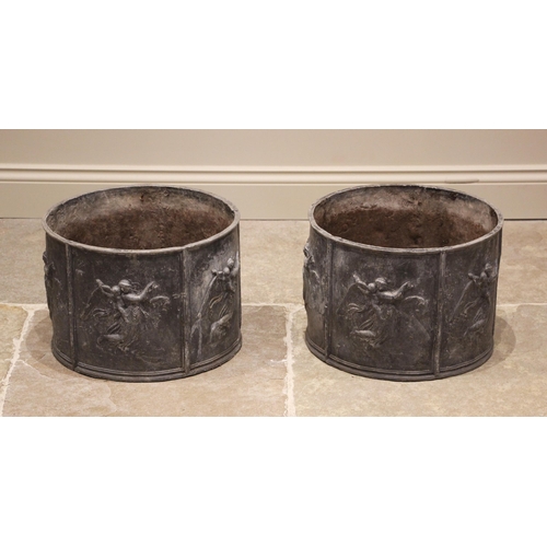 1227 - A pair of cylindrical lead planters, formed with six panels each cast in relief with winged classica... 