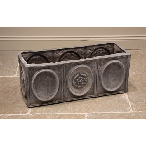 1230 - A lead planter trough, of rectangular form, cast in relief with oval panels punctuated with a Lancas... 