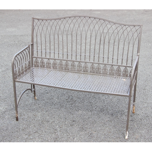 1238 - A Regency style painted metal strap and wirework garden/patio bench, 20th century, the serpentine wi... 