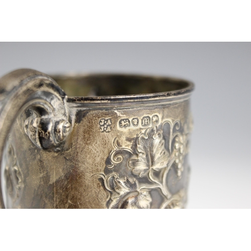 126 - A silver mug Joseph Angell I & Joseph Angell II, London 1847, embossed in high relief with frolickin... 