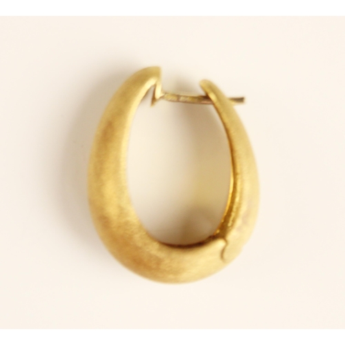 379 - A pair of yellow metal hoop earrings, the wide graduated hoops with brushed matte detail, with post ... 