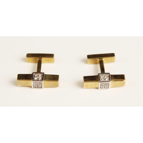 385 - A pair of diamond and 9ct yellow gold cufflinks, the cufflinks designed as a yellow gold rectangular... 