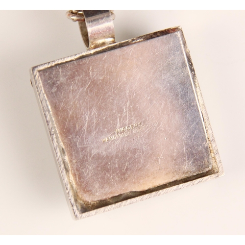 386 - A ‘Wiggers’ citrine pendant, the square silver coloured pendant with rough cut pieces of citrine wit... 