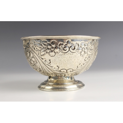 77 - An Edwardian silver pedestal bowl, Fenton Brothers Ltd, Sheffield 1903, the florally embossed bowl w... 