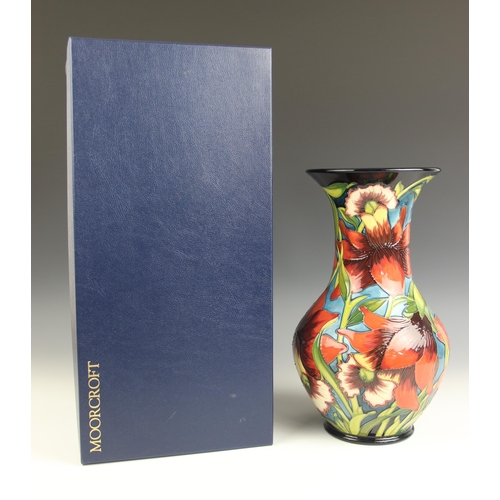 860 - A Moorcroft limited edition baluster vase of large proportions, decorated in the Fleur Rouge pattern... 