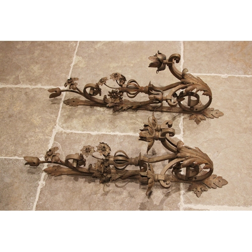 1001 - A near pair of gilt painted wrought iron wall sconces, 19th century, the scrolled branches applied w... 