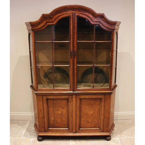 1099 - An 18th century Dutch walnut and floral marquetry side cabinet, profusely inlaid with chequered stri... 