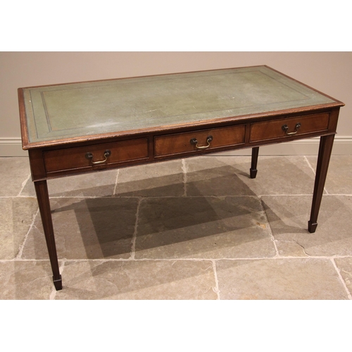 1192 - A mahogany library table, 20th century, the rectangular moulded top inset with a gilt tooled green l... 