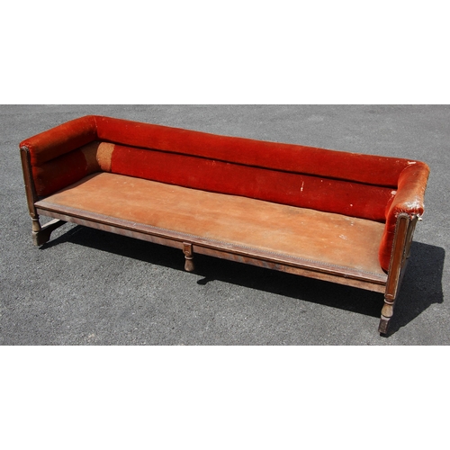 1215 - An oak and upholstered billiard room settle/sofa, early 20th century, the twin roll low back and sid... 