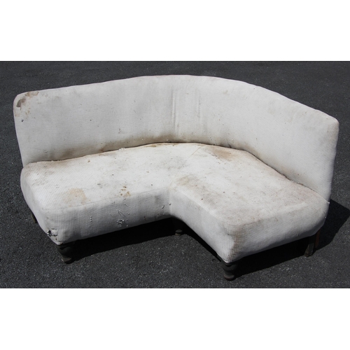 1221 - A contemporary corner sofa, 20th century, of curved 'C' form, upon painted vase shaped legs, 68cm H ... 