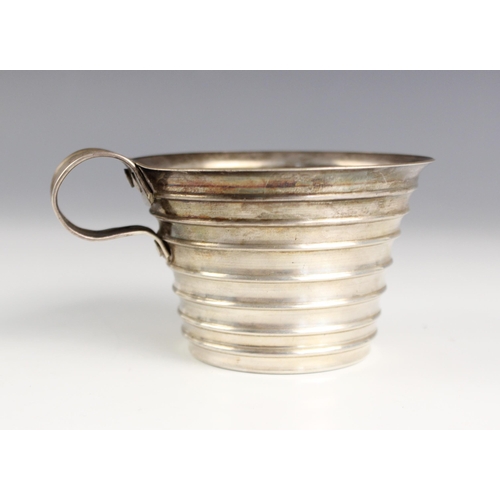 82 - Five silver coloured punch cups, early 20th century, each of tapering ribbed design and with simple ... 