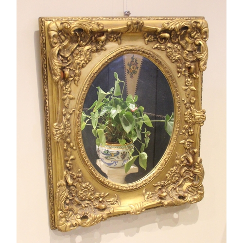 1069 - A Louis XVI style giltwood and composite wall mirror, late 20th century, the rectangular frame with ... 