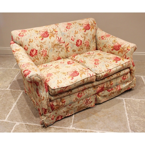 1179 - A two seater sofa, late 19th/early 20th century, of cottage proportions, later re-covered in floral ... 