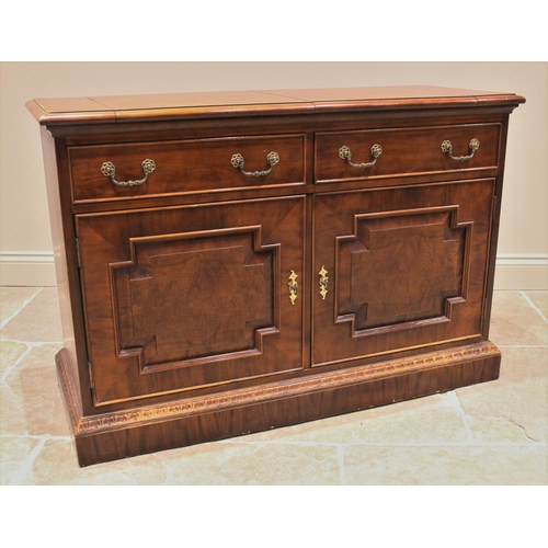 1222 - A 19th century style buffet/sideboard, late 20th century, the rectangular moulded top with twin fold... 