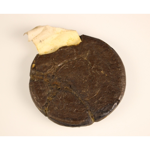 553 - A 17th century wax seal, originally attached to an indenture, or circular form and relief decorated ... 