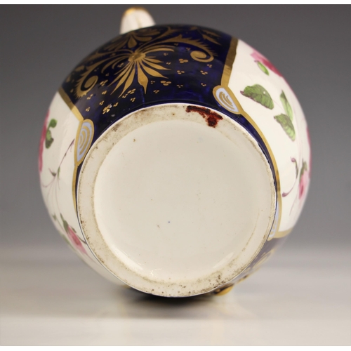 801 - A Victorian Staffordshire jug, painted with a central rose motif to each side, gilt foliate decorati... 