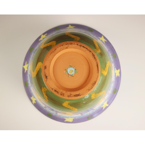 843 - A Sally Reid (British, 1948-2021) terracotta glazed bowl, 20th century, decorated with stars and wav... 