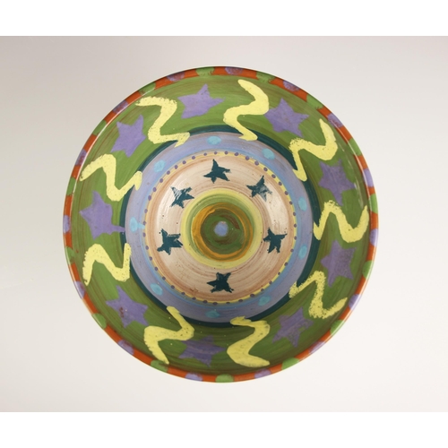 843 - A Sally Reid (British, 1948-2021) terracotta glazed bowl, 20th century, decorated with stars and wav... 