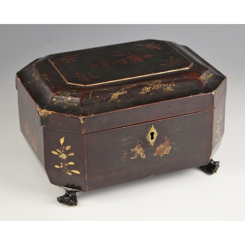 1076 - A Chinese lacquered tea caddy, 19th century, of sarcophagus form with hinged cover opening to reveal... 