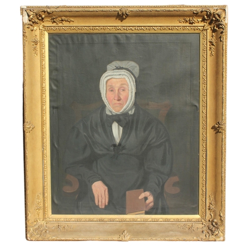 694 - English school (19th century),  
A half length portrait of a seated spinster in a bonnet holding a b... 