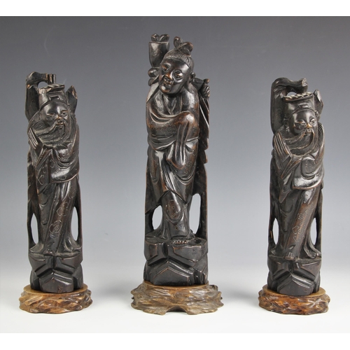 729 - A set of three Chinese carved wood and metal inlaid figures of sages, early 20th century, each model... 