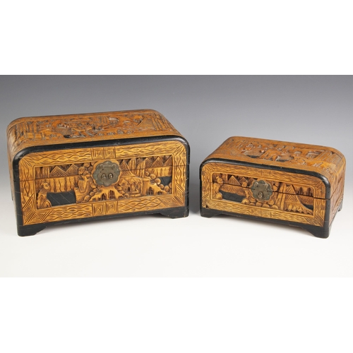 730 - A Chinese carved camphor wood box and cover, 20th century, of rectangular form and heavily carved wi... 