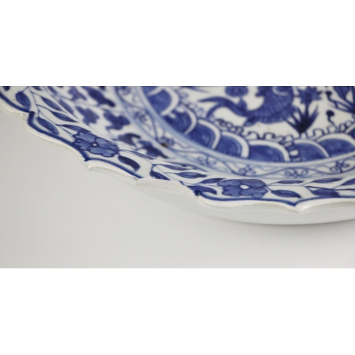 734 - A large Chinese porcelain blue and white bowl, Yongzheng mark but later, of circular form with ogee ... 