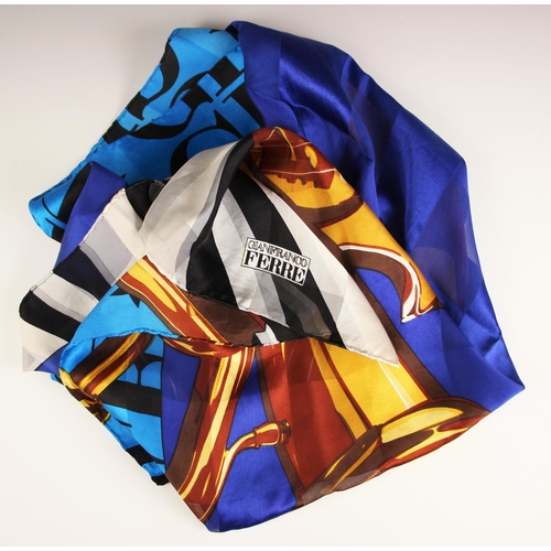 1023 - A Gianfranco Ferre silk scarf, designed with a tuba, a cello and piano keys against a vivid blue gro... 