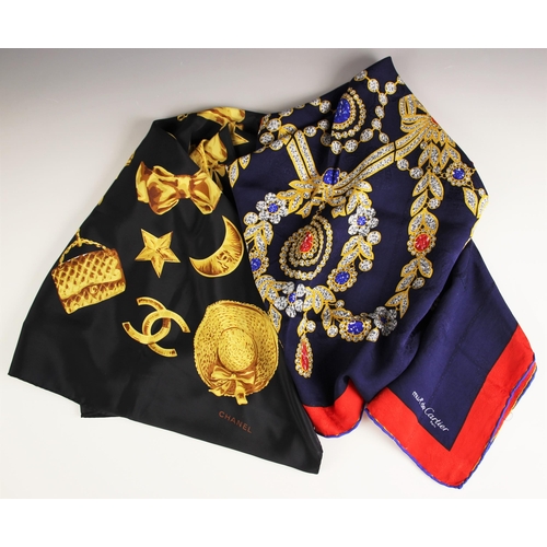 1026 - A Chanel silk scarf, the black scarf designed as gold charms and 'CC' logos, 89cm x 86cm, along with... 