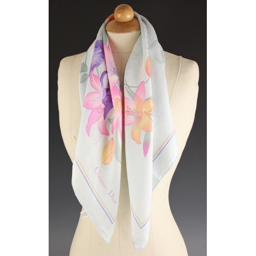 1027 - A Christian Dior silk scarf, the abstract stripe design scarf in red, blue, yellow, brown and white,... 