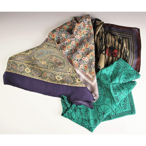 1030 - Four Liberty of London silk scarves, to include; a paisley pattern scarf in navy, green and brown to... 