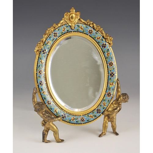 1065 - A French lacquered brass and champleve enamel mirror, late 19th or early 20th century, the enamel bo... 