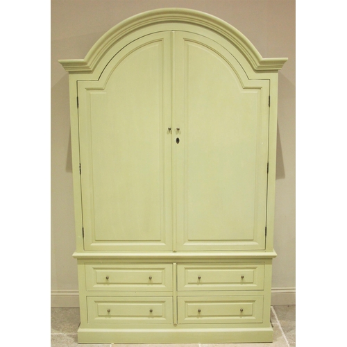 1220 - A painted 19th century style linen press, late 20th century, the arched moulded pediment over a pair... 