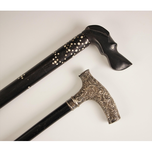 550 - A Victorian silver handled walking cane, with ebonised shaft and florally embossed handle, 88cm long... 