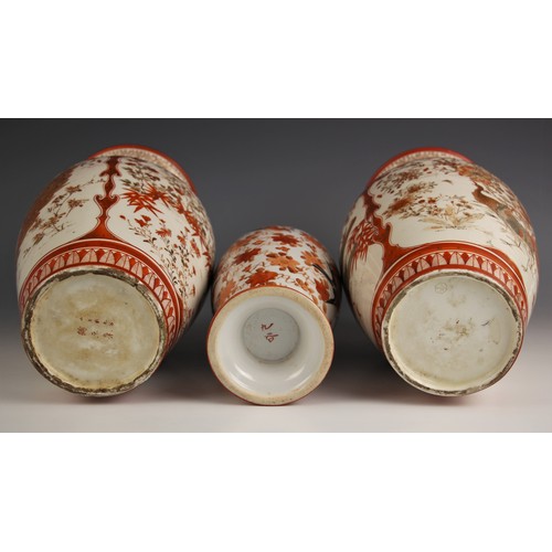 744 - A pair of Japanese Kutani porcelain vases, Meiji period (1868-1912), each decorated with two panels ... 