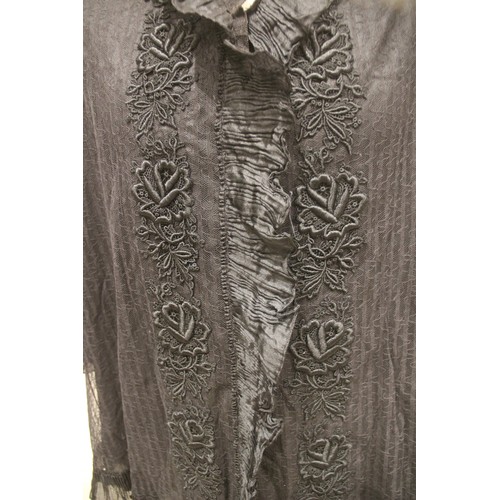 1047 - An early 20th century dressing jacket, the black lace jacket with ruffle silk edging to the cuffs an... 