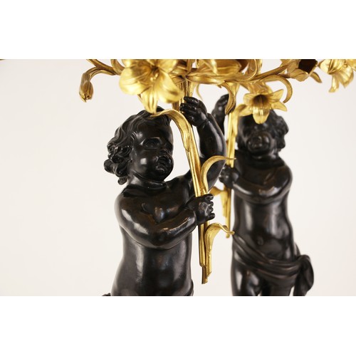 538 - A pair of Napoleon III style bronze and ormolu candelabra after Claude Michel (French, 1738-1814, kn... 